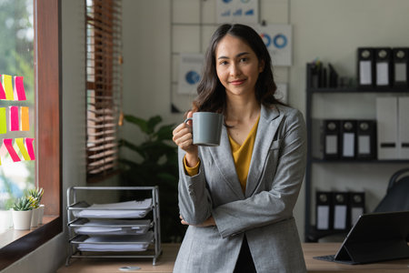Beautiful asian businesswoman working in office. business finance conceptの写真素材