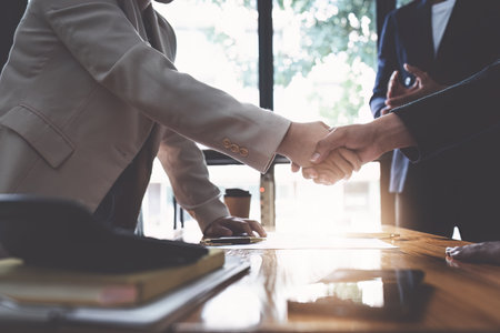 Business shaking hands. Successful businessmen handshaking after good deal. Finishing up meeting...