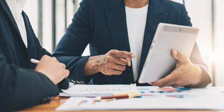 Business people analyze fund investment by digital tablet. Business Consulting, meeting, finance investment conceptの写真素材