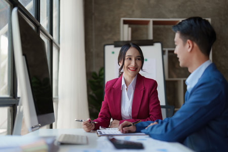 Beautiful business woman consultant talking with asian business person at meeting room with new...