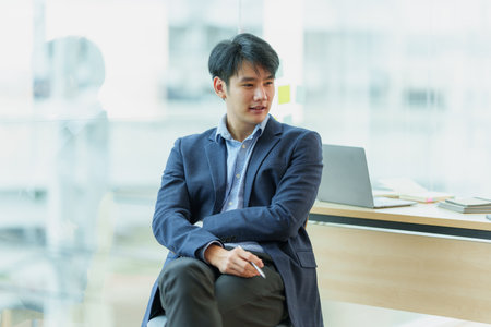 A successful entrepreneur analyzing a technical price graph and indicator. The concept of a bank account, a savings account, or an insurance policy.の写真素材