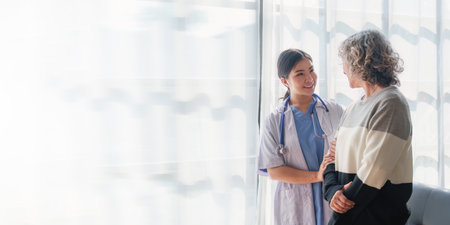 Home healthcare nurse, physical therapy with senior adult woman at homeの写真素材