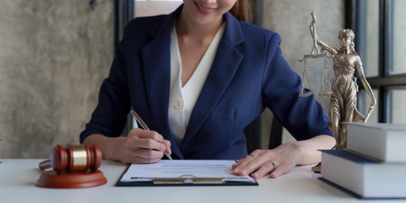Close up of business lawyers working with agreement contract in office. Law, legal services, advice, Justice conceptの写真素材