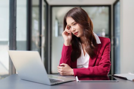Stressed Business woman checking budget of company, taxes, bank account balance and calculating...