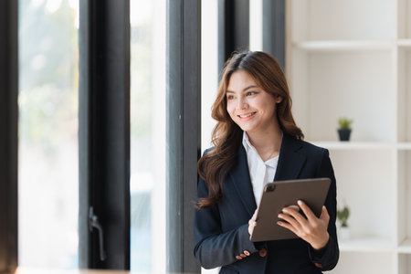 Smart business people working together with financial data in the digital tablet at co working space. finance and account concept.の写真素材