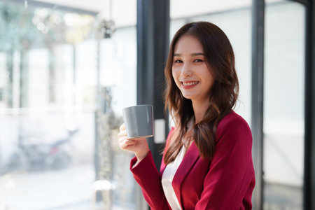 Beautiful asian business woman working on a laptop at office. Financial analysis and tax conceptの写真素材