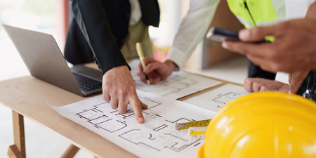 Civil Construction team working at renovate construction site. architectural plan, engineer...