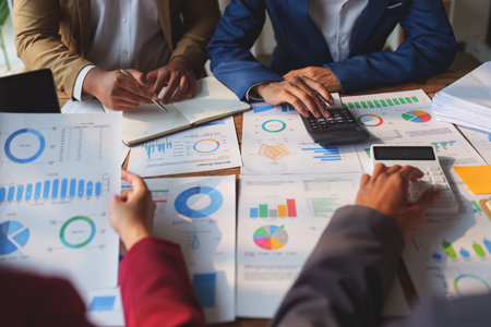 Business team working with financial document at office. analysis, discussion and brainstorming, business strategyの写真素材