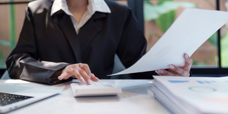 Business woman analytic finance statistics and planning strategy with financial paperwork. tax, report, accounting conceptの写真素材