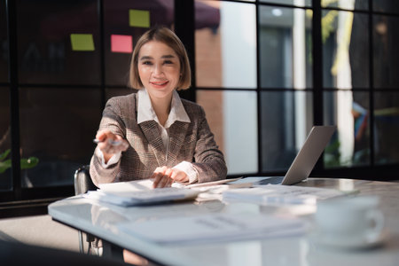 Business woman analytic finance statistics and planning strategy with financial paperwork. tax, report, accounting conceptの写真素材