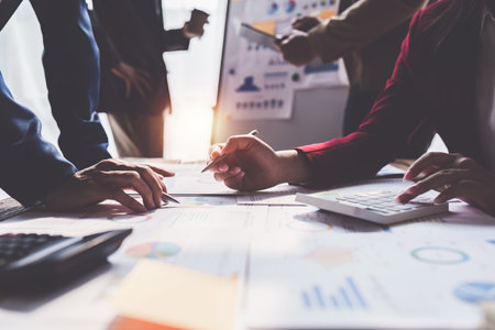 Business team working with financial document at office. analysis, discussion and brainstorming, business strategyの写真素材