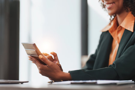 Accountant black woman working on laptop and do document, tax, exchange, accounting and Financial advisor conceptの写真素材