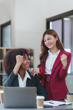 Diverse Happy Business people celebrating success at company, teamwork, triumph, victory, achievement conceptの写真素材