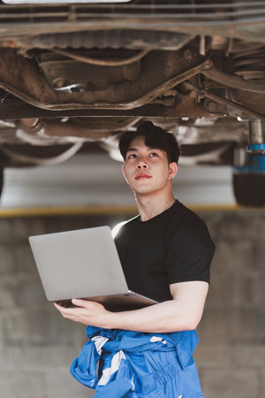 Expert auto mechanic repair and service customer service work on car at garage. automobile car conceptの写真素材