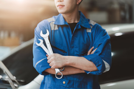 Expert auto mechanic repair and service customer service work on car at garage. automobile car conceptの写真素材