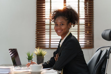 Accountant black woman working on laptop and do document, tax, exchange, accounting and Financial advisor conceptの写真素材