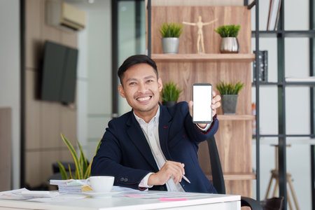 Businessperson using online banking service on mobile phone, finance, technology, smartphone conceptの写真素材