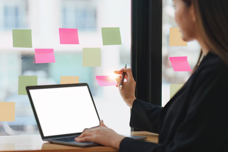 Businessperson or Accountant checking finance data document for investigation of corruption account on laptop computer. Anti Bribery conceptの写真素材