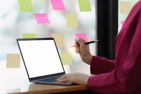 Businessperson or Accountant checking finance data document for investigation of corruption account on laptop computer. Anti Bribery conceptの写真素材