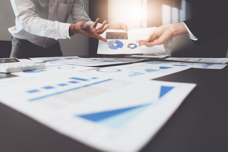 Group of Business people or Accountant checking finance data document for investigation of...