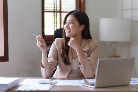 Accountant asian business person analysis finance document, tax, exchange, accounting and Financial advisor conceptの写真素材