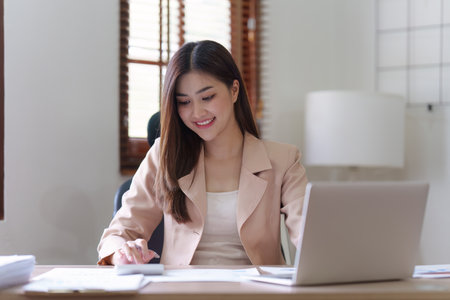 Accountant asian business person analysis finance document, tax, exchange, accounting and Financial advisor conceptの写真素材