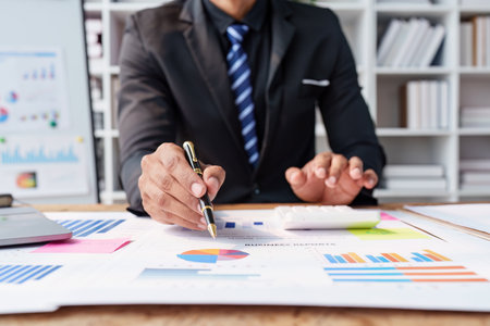 Accountant asian business person analysis finance document, tax, exchange, accounting and Financial advisor conceptの写真素材