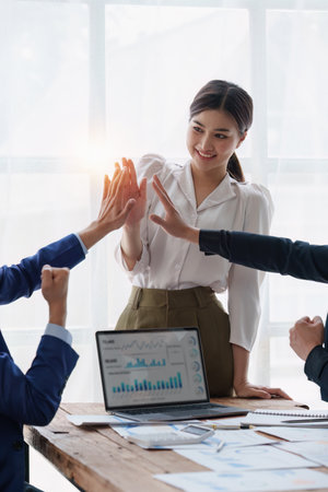 Group of Business People Meeting and Corporate partnership and achievement concept. Business people celebrate when successful work projectの写真素材