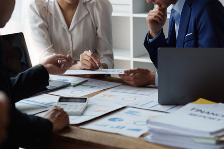 Group of Business People Meeting analysis financial plan, discussion, research with paperwork at office, accounting conceptの写真素材