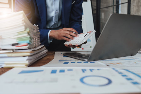Accountant asian business person analysis finance document, tax, exchange, accounting and Financial advisor conceptの写真素材