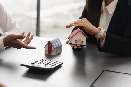 Close up Business people or Real Estate agent explain signing agreement for sale house to client. Property, Insurance, Broker conceptの写真素材