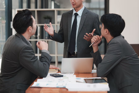 Close up of Diverse colleagues gather brainstorm discuss financial statistics at office meeting. finance, teamwork, Big data Graphs Charts conceptの写真素材