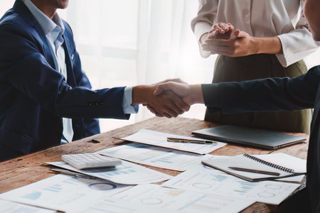 Business people handshake. Successful businessmen handshaking after good deal. Finishing up meeting conceptの写真素材