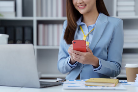 Beautiful Businesswoman completes KYC using an online banking program in order to open a digital savings account. The definition of cyber securityの写真素材