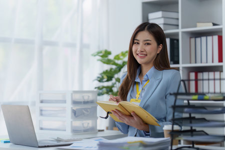 Accountant woman working on laptop and do document, tax, exchange, research, accounting and Financial advisor conceptの写真素材