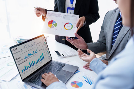 Group of Business people using AI to help and analysis and research finance data. Artificial...
