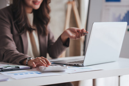 Confident business person executive using laptop computer, having video conference call virtual meeting, advisor finance, research, fundの写真素材