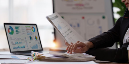 Accountant woman working on laptop and do document, tax, exchange, research, accounting and Financial advisor conceptの写真素材