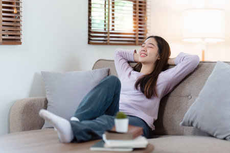 Attractive Asian woman resting comfortable living room and sleep, Relax, Sofa, Lifestyleの写真素材