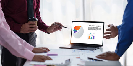 Close up of Diverse colleagues gather brainstorm discuss financial statistics at office meeting. finance, teamwork, Big data Graphs Charts conceptの写真素材