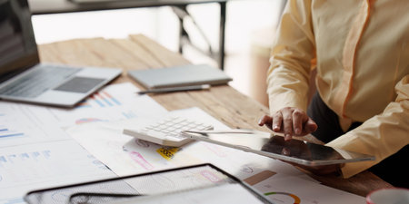 Accountant asian woman working on tablet and do document, tax, exchange, accounting and Financial...