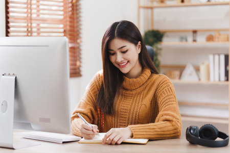 Attractive Asian woman resting comfortable living room and using desktop computer, Relax, Sofa, Lifestyleの写真素材