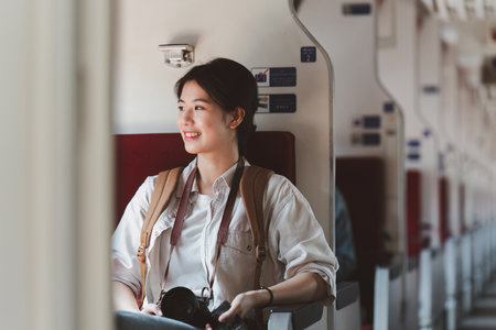 Asian Tourist person backpacker to travel at train station. Tourism and travel in the summerの写真素材