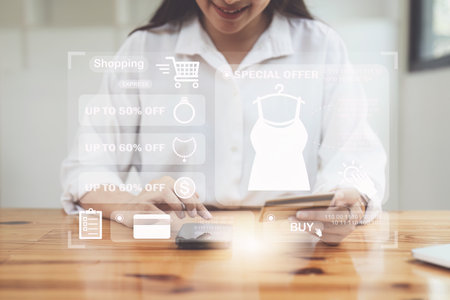 Online store icon, shopping on internet, Asian woman using on virtual screen with hands choosing on smartphone applicationの写真素材