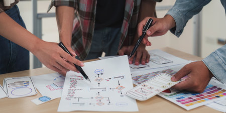 Close up ux developer and ui designer brainstorming interface wireframe design.Creative digital development agencyの写真素材