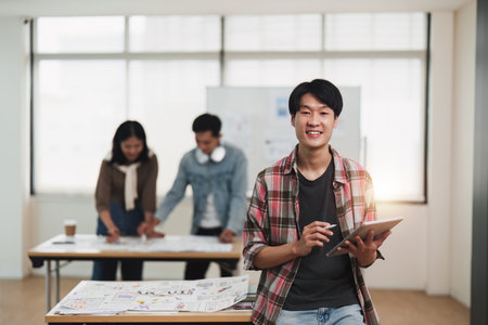 Team of ux developer and ui designer brainstorming interface wireframe design.Creative digital development agencyの写真素材