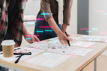 Close up ux developer and ui designer brainstorming interface wireframe design.Creative digital development agencyの写真素材