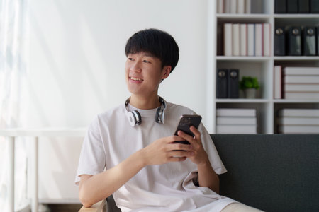Online store, shopping on internet, Asian man using on virtual screen with hands choosing on smartphone applicationの写真素材