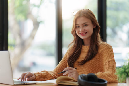 Beautiful young Asian woman college student at classroom. College student working on the college campus. back to school conceptの写真素材