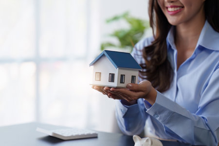 Real Estate agent offers home ownership and life insurance to clientの写真素材